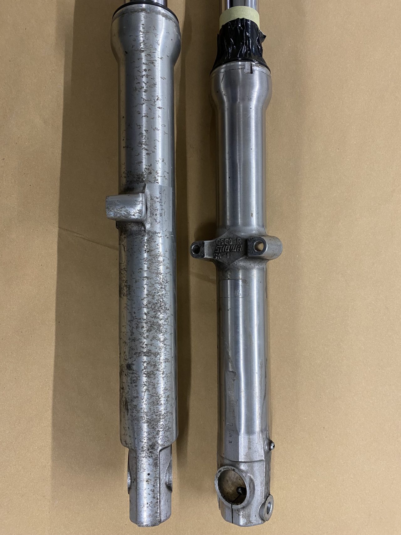 Motorcycle forks before & after CTC Powder Coating