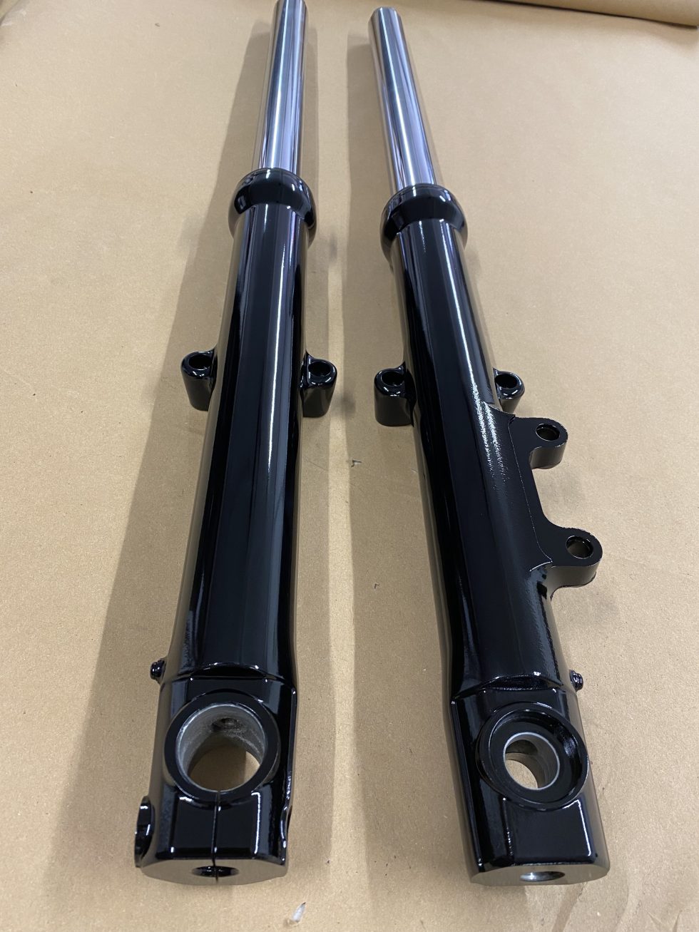 Motorcycle forks before & after CTC Powder Coating